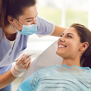 Dental patient smiling at dental team member