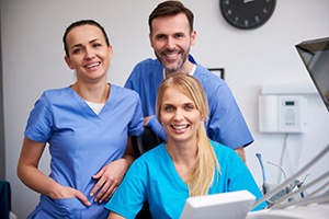 Three happy dental team members