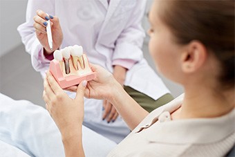 patient learning about dental implants