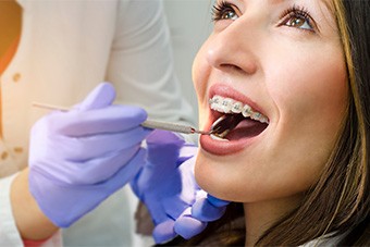 patient smiling while visiting orthodontist